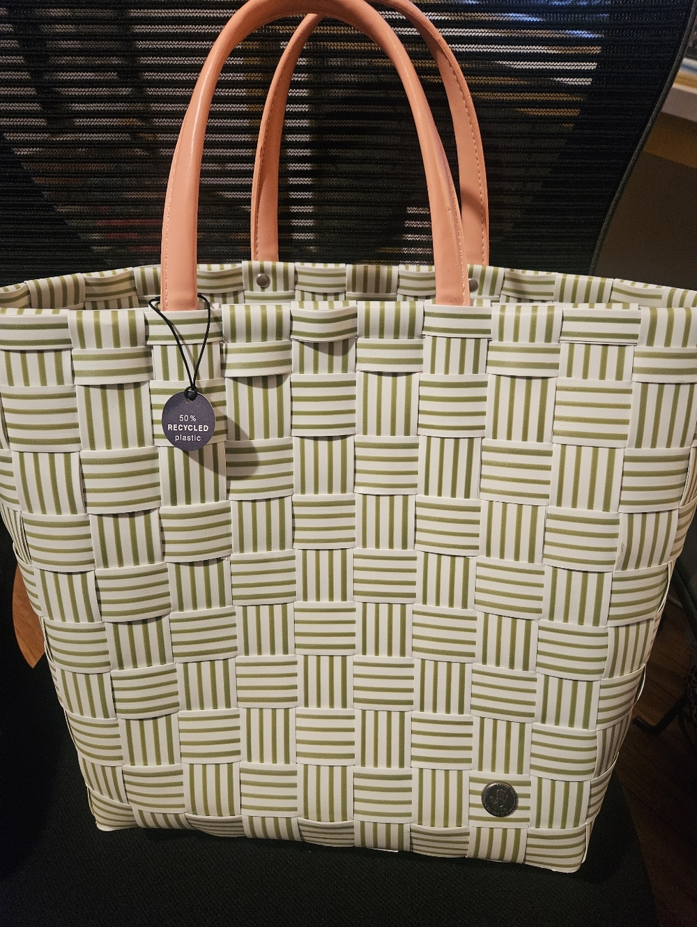 Woven Stripe Tote Bag with Peach Handles. Handmade With 50 Percent Plastic.